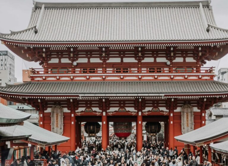 Bustling crowd gathers at Senso-ji Temple, Tokyo's famous historic site.