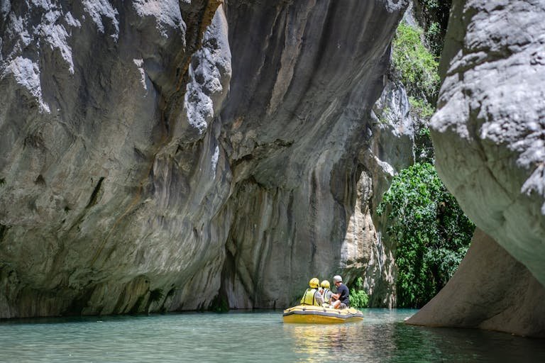 Explore stunning limestone cliffs while rafting in Kemer, Antalya.