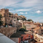 Explore the charming historical architecture of Toledo, Spain under a bright day.