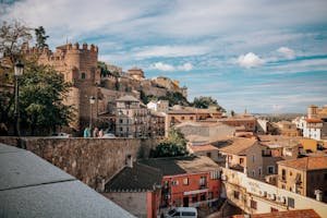 Explore the charming historical architecture of Toledo, Spain under a bright day.