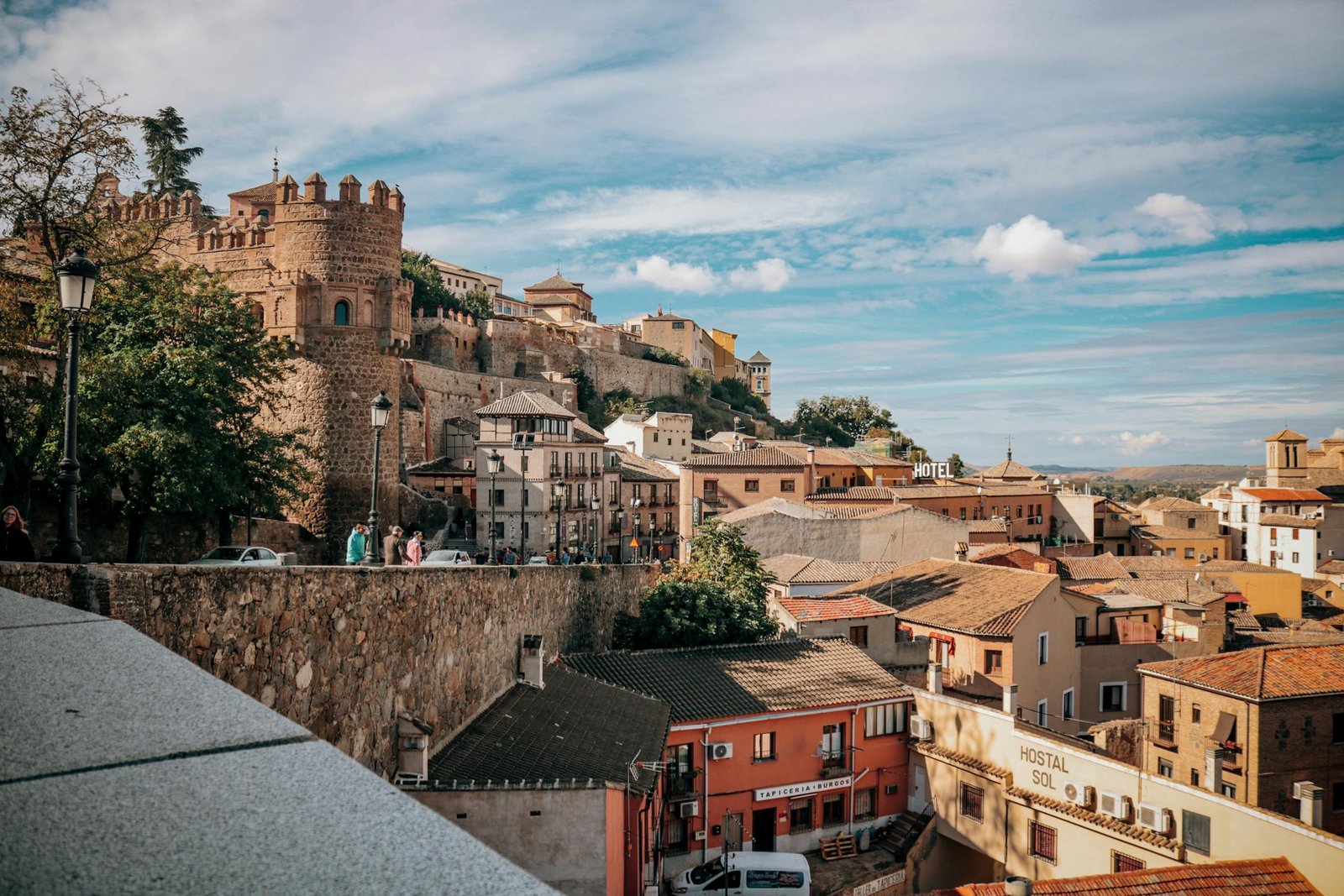 Explore the charming historical architecture of Toledo, Spain under a bright day.