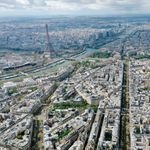 Stunning aerial panorama of Paris featuring the iconic Eiffel Tower and the River Seine.